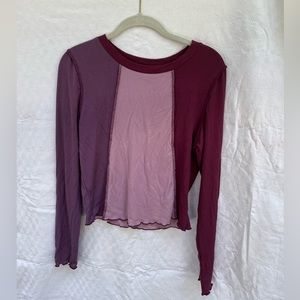 Women’s long sleeve with three different colored panels with raw edge hem